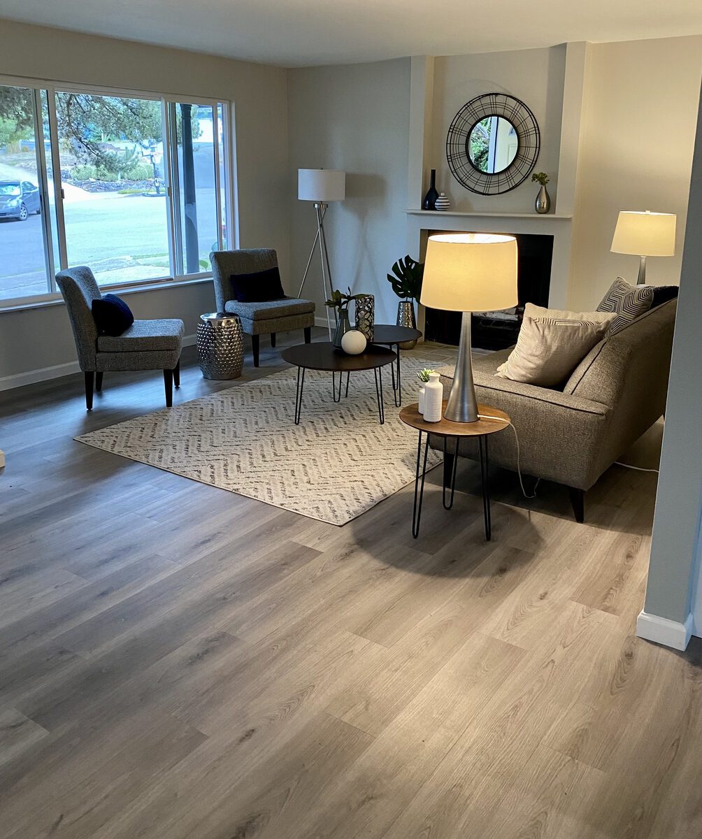 Living room with newly installed wide-plank vinyl flooring