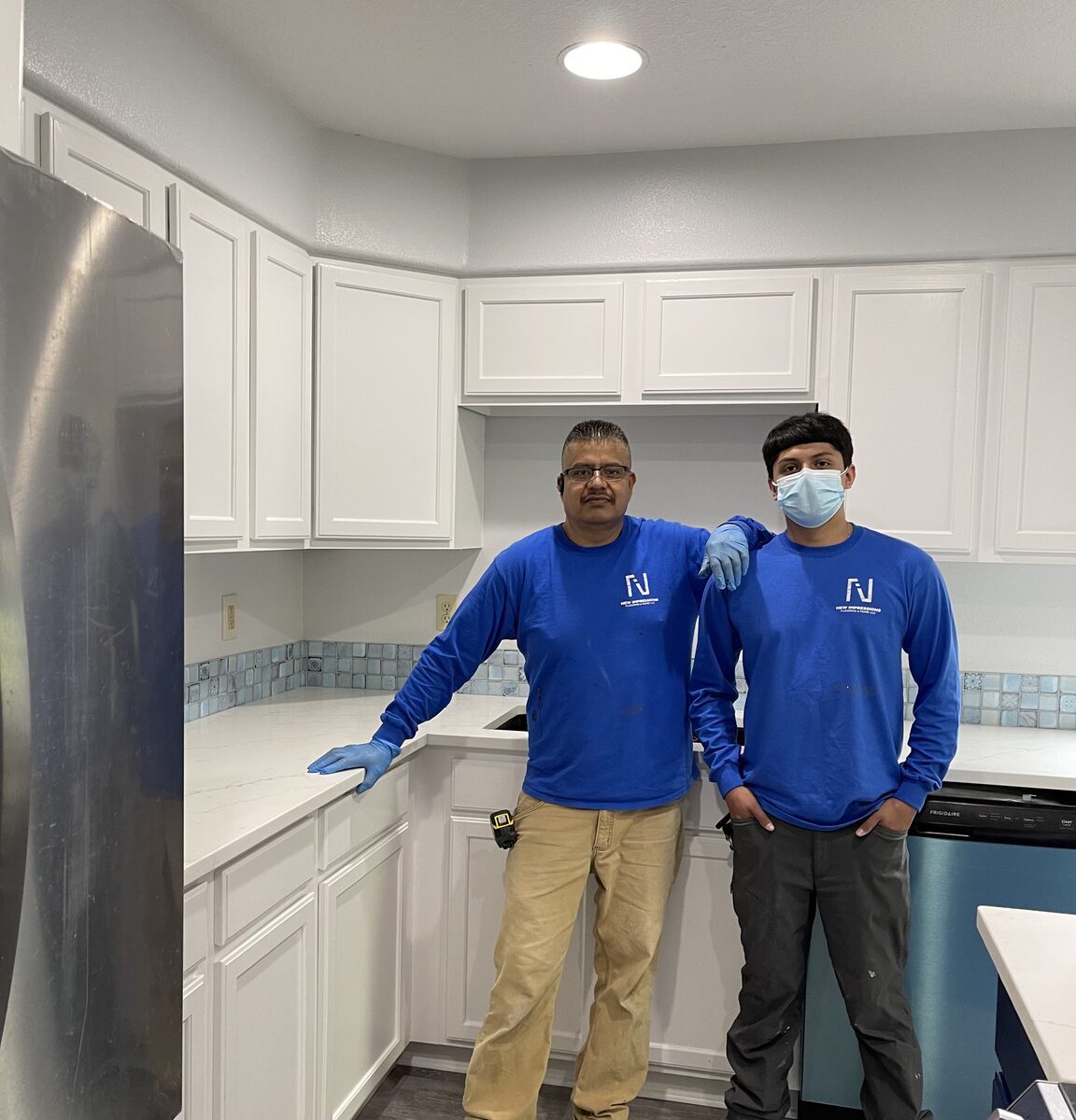 Norberto Gaona and his son on a kitchen remodel job site